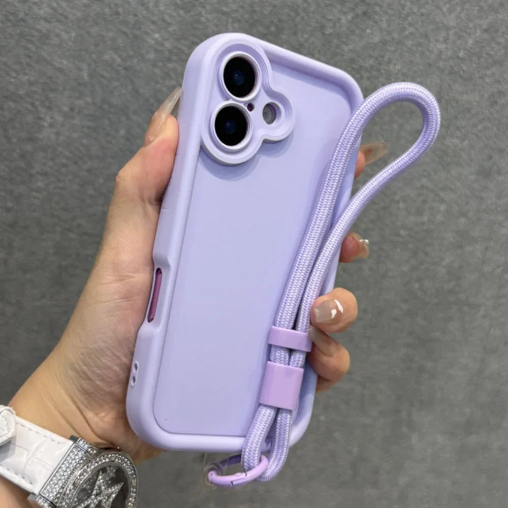 Purple silicone phone case with an integrated wrist strap.