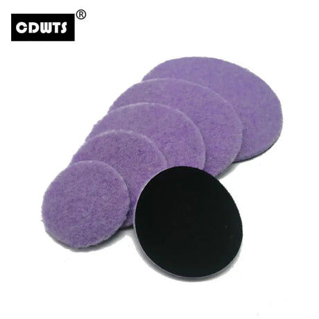 a purple sponge with a black circle on top