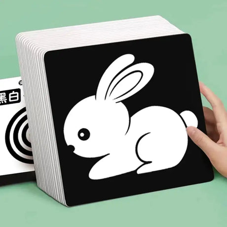 a person holding a card with a rabbit on it