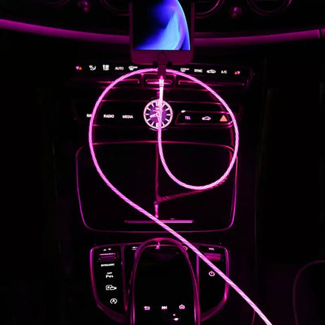 a car dashboard with a purple light on it