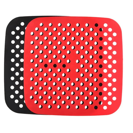 a red and black plastic cutting board with holes