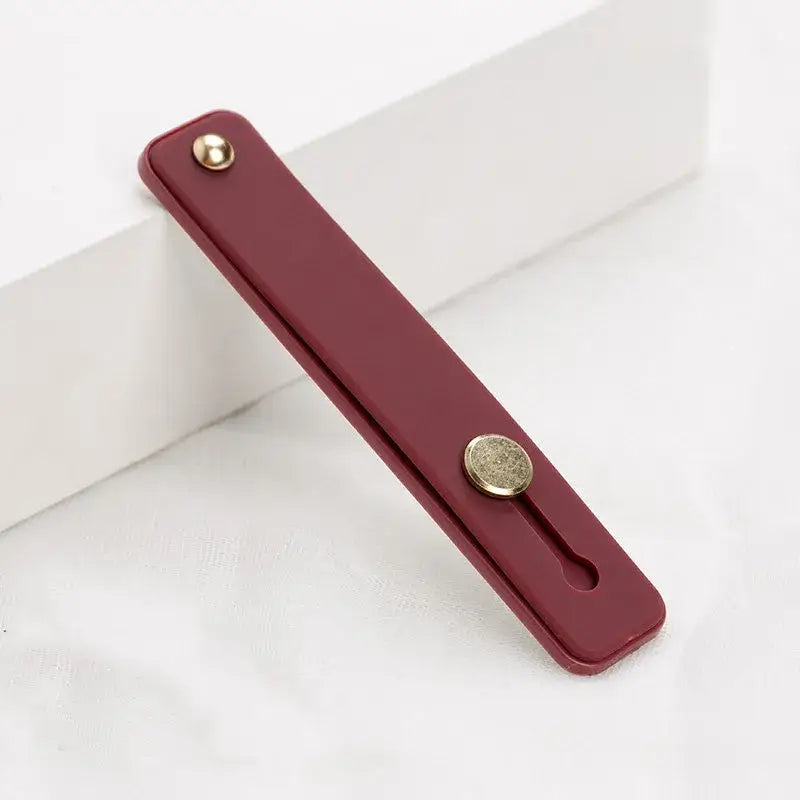 A red door handle on a white background