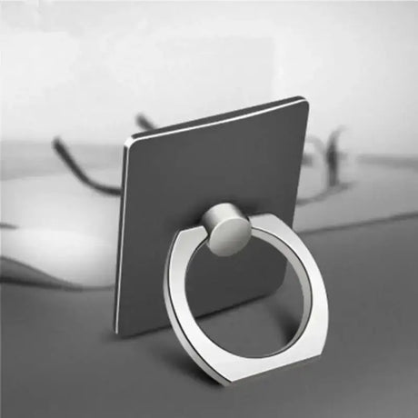 a ring on a table with a laptop