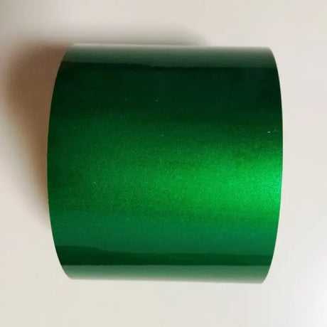a roll of green foil on a white background