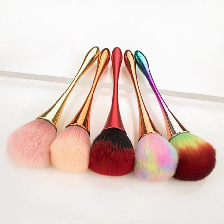 a close up of a bunch of makeup brushes on a table