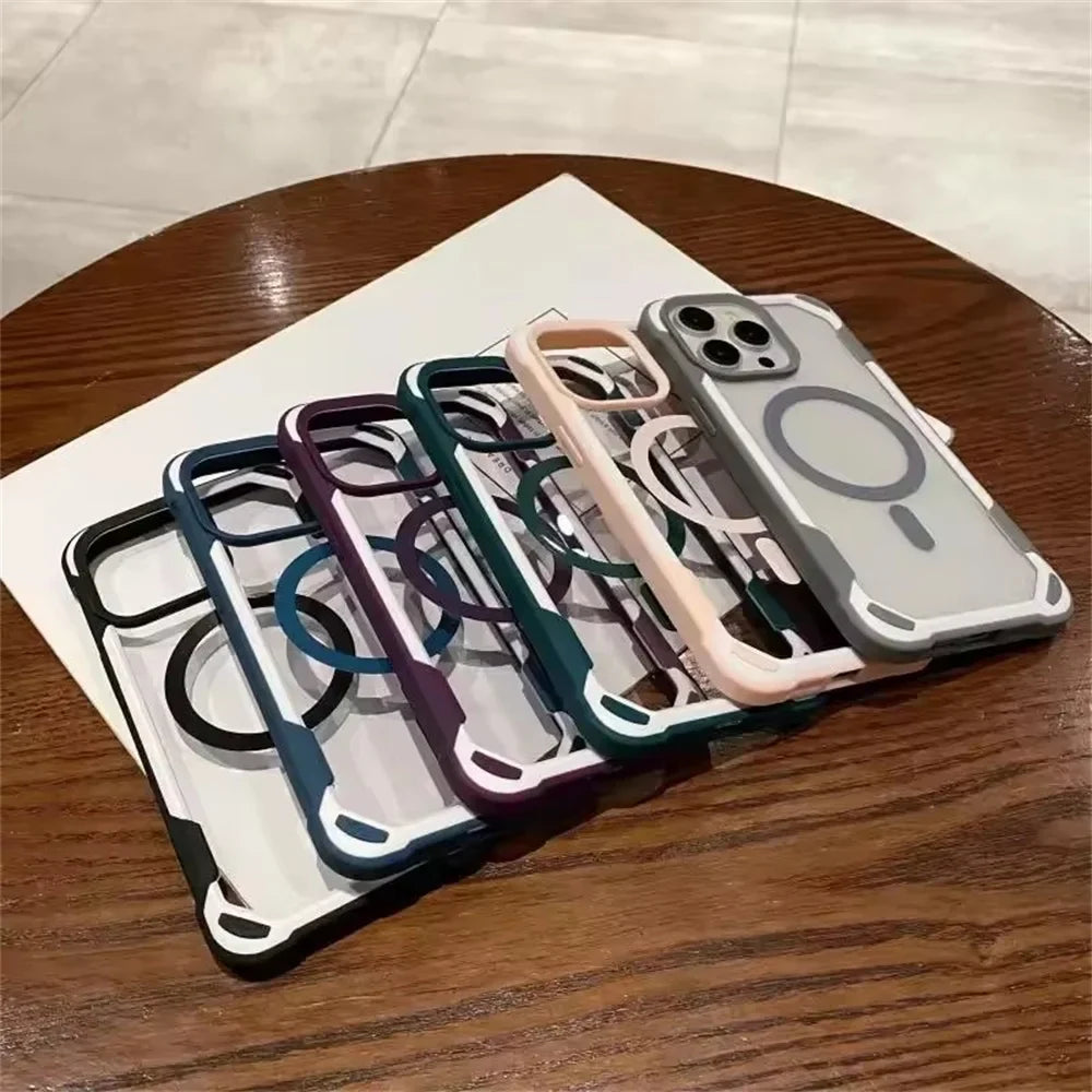 A row of five clear phone cases with colorful, reinforced edges and magnetic charging rings.