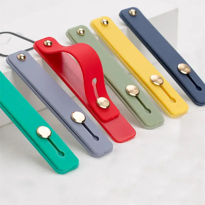 A set of four colorful plastic clips