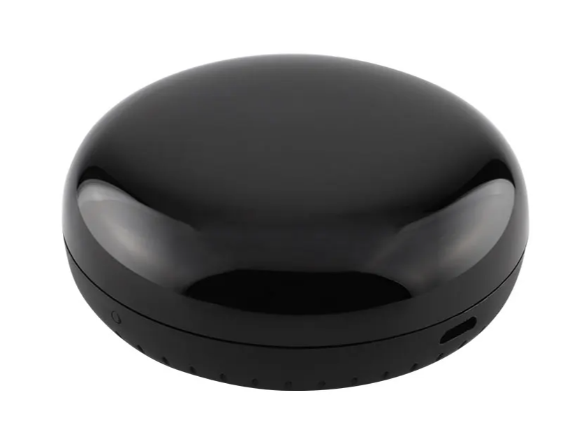 Shiny black puck-shaped device.