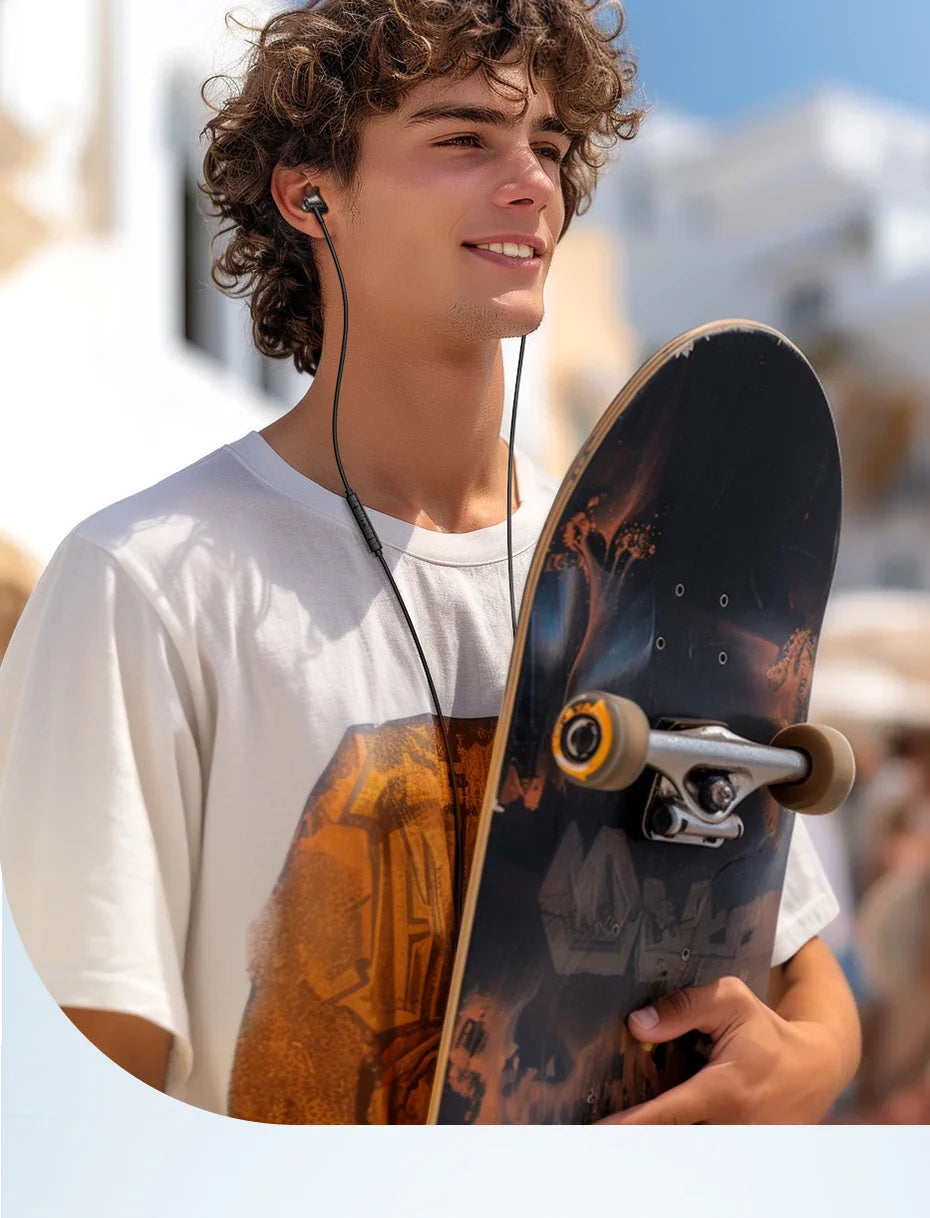 Skateboard with a dark graphic design held by a young person wearing earbuds and a white t-shirt.