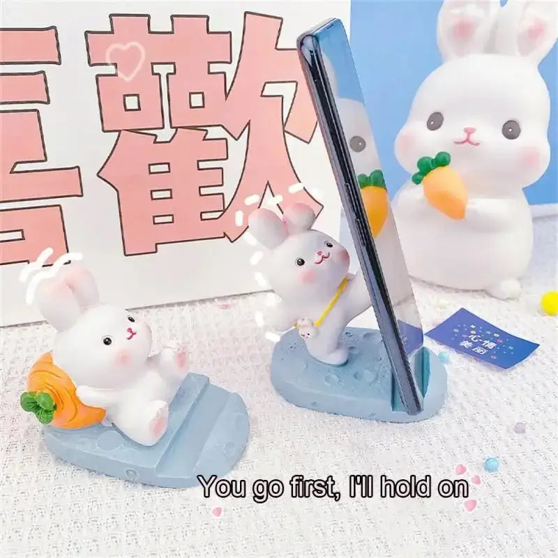 a small white rabbit with a pencil and a pen