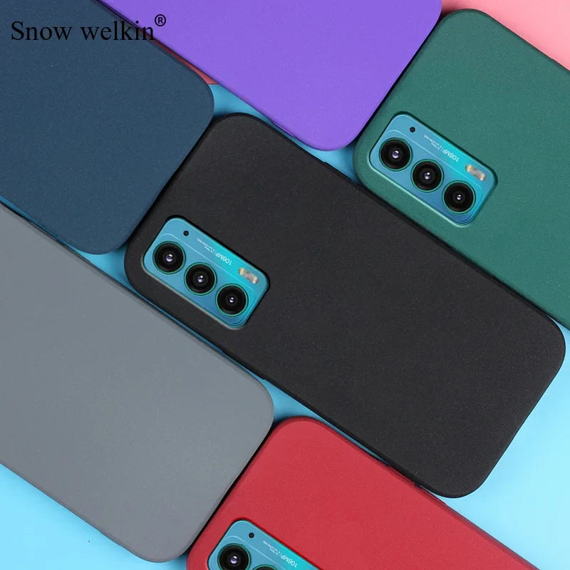 Smartphone cases in various colors with triple camera cutouts.
