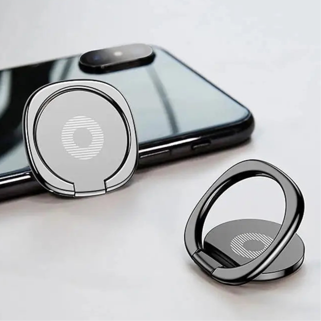 Smartphone ring holder with circular design and metallic finish.