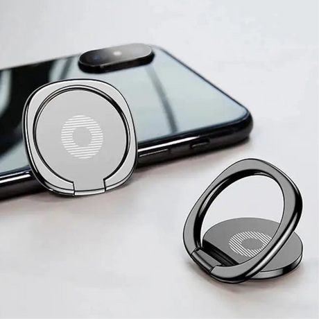 Smartphone ring holder with circular design and metallic finish.