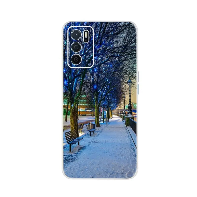 a snowy scene with a bench and trees in the background