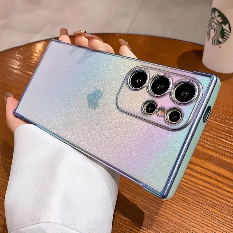 A sparkly, iridescent phone case with a heart accent and clear camera lens cutouts.
