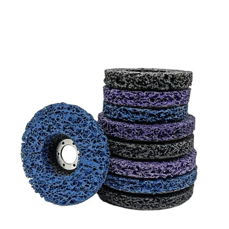 a pile of blue and black polishing discs