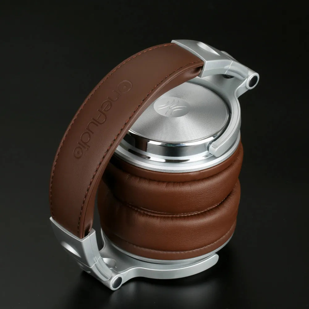 Stylish brown leather and metal headphones with a closed-back design.
