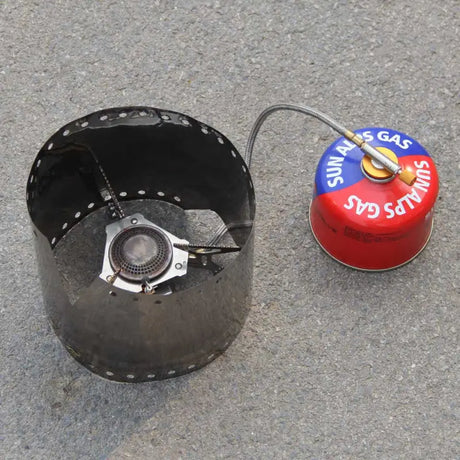 there is a red gas can and a blue gas can on the ground