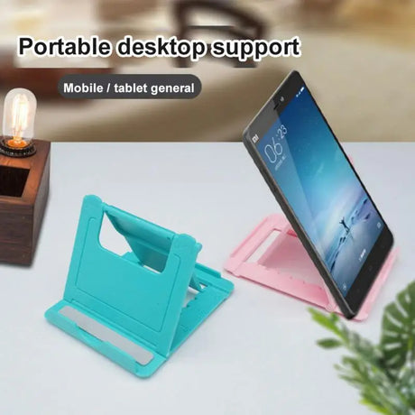 a tablet and a phone stand on a table