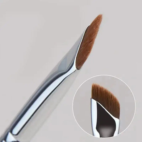a close up of a brush with a white background