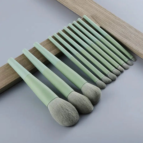the green brush set is shown with a wooden frame