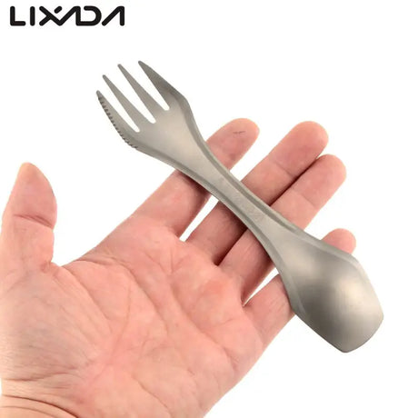 a hand holding a fork and knife