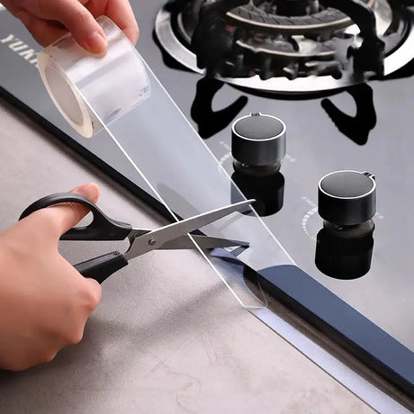 a person using a knife to cut a piece of glass