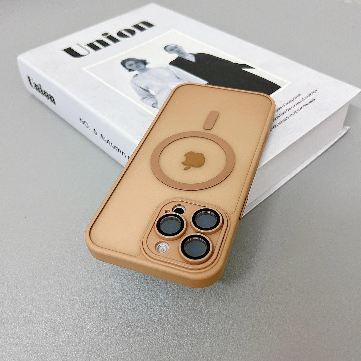 Tan iPhone case with magnetic ring.