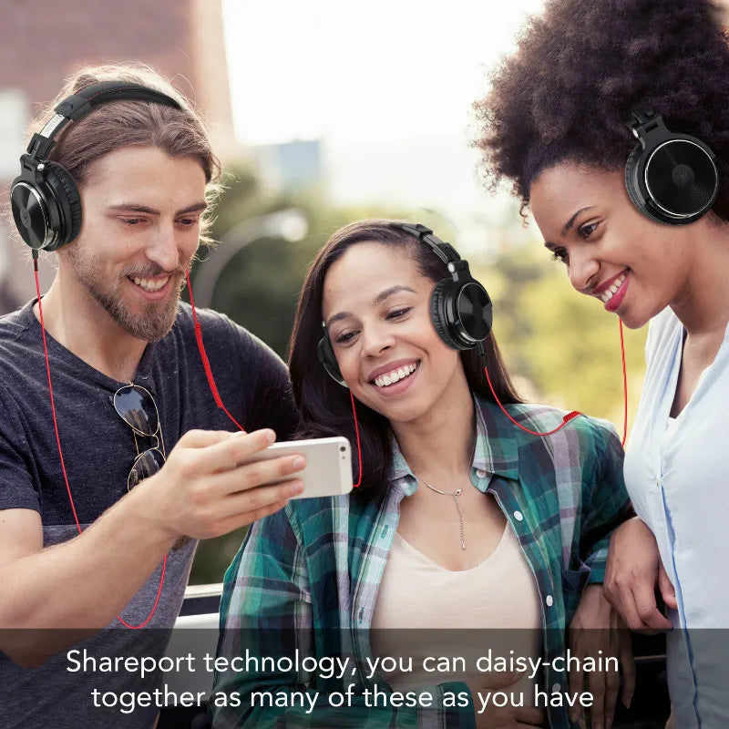 Three friends wearing headphones and looking at a smartphone together.
