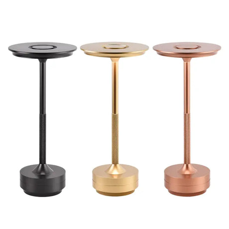 three different metal table legs with a round base