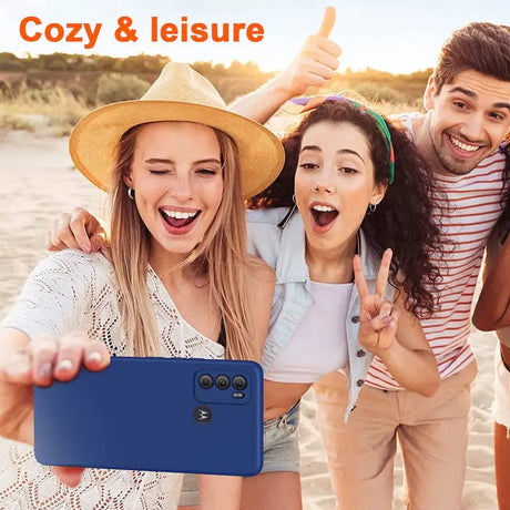 there are three people taking a picture together on the beach