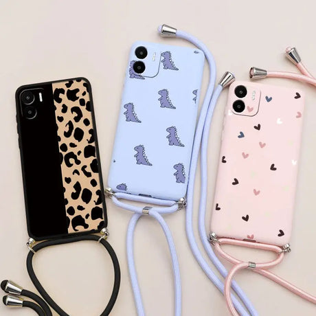 there are three cell phones with a strap and a phone case