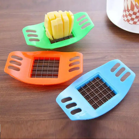 three pieces of fruit cutters on a table