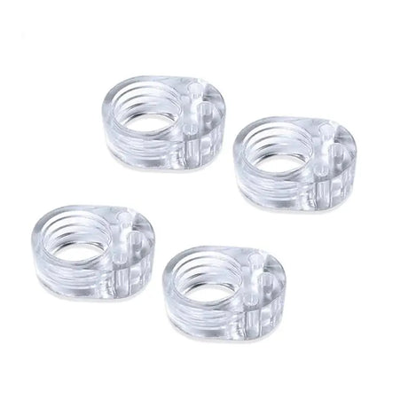 four clear plastic rings with a white background