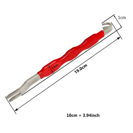 a red plastic tool with a white handle
