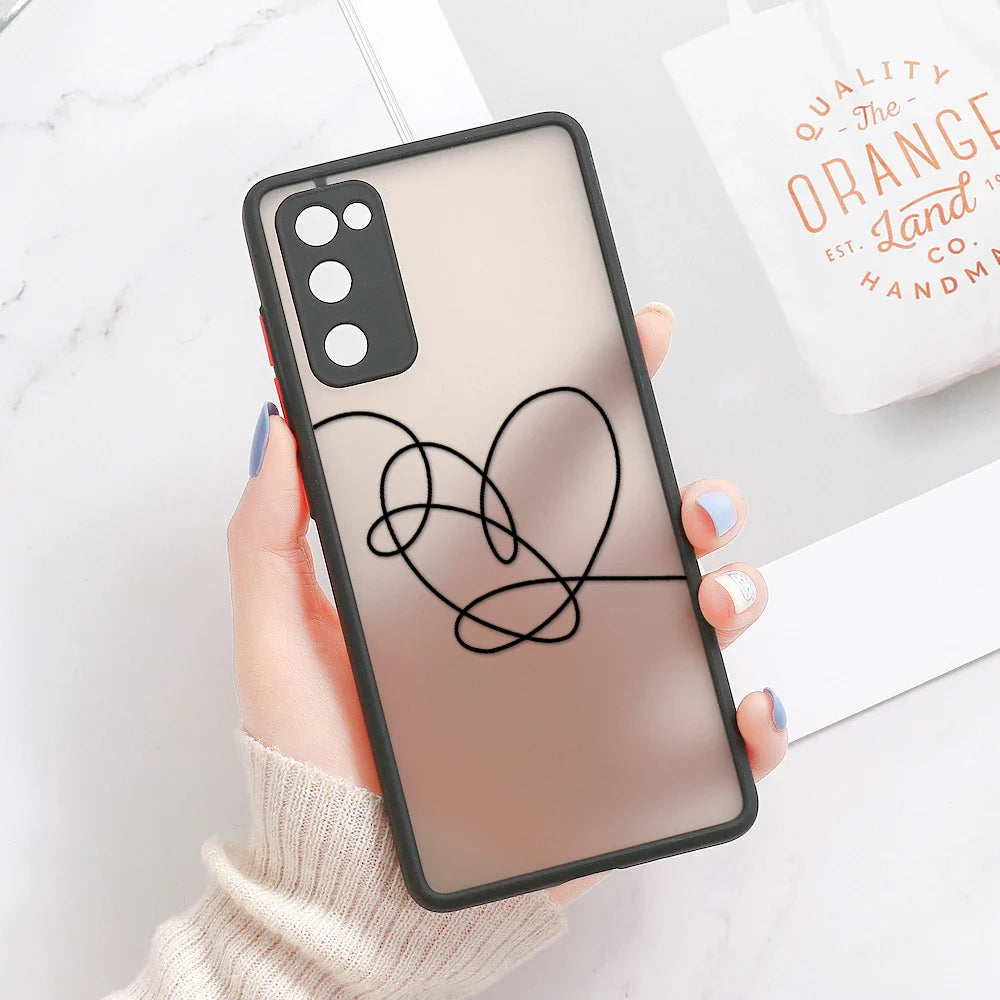 Translucent rose gold samsung galaxy phone case with black bumper and black heart line art design on back