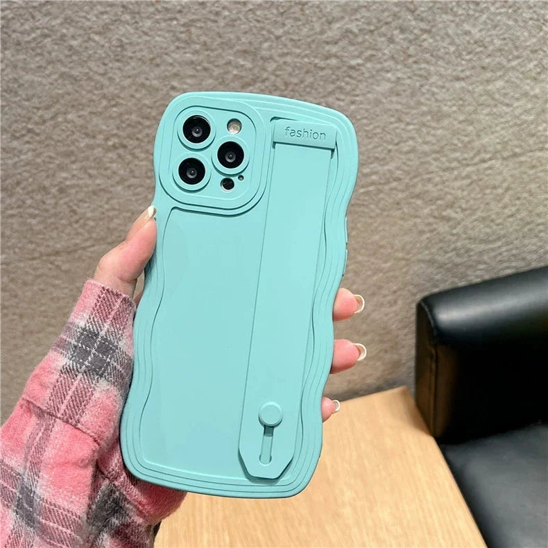 Turquoise phone case with a hand strap.