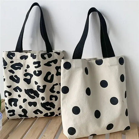 two bags with black and white spots on them