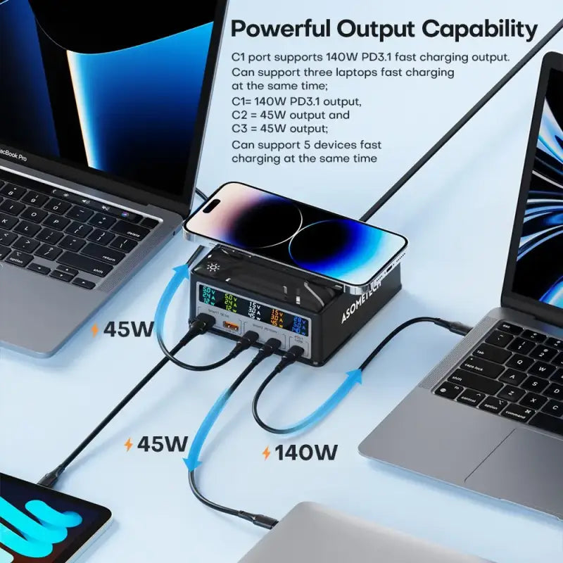 There are two laptops and a laptop computer connected to a power strip