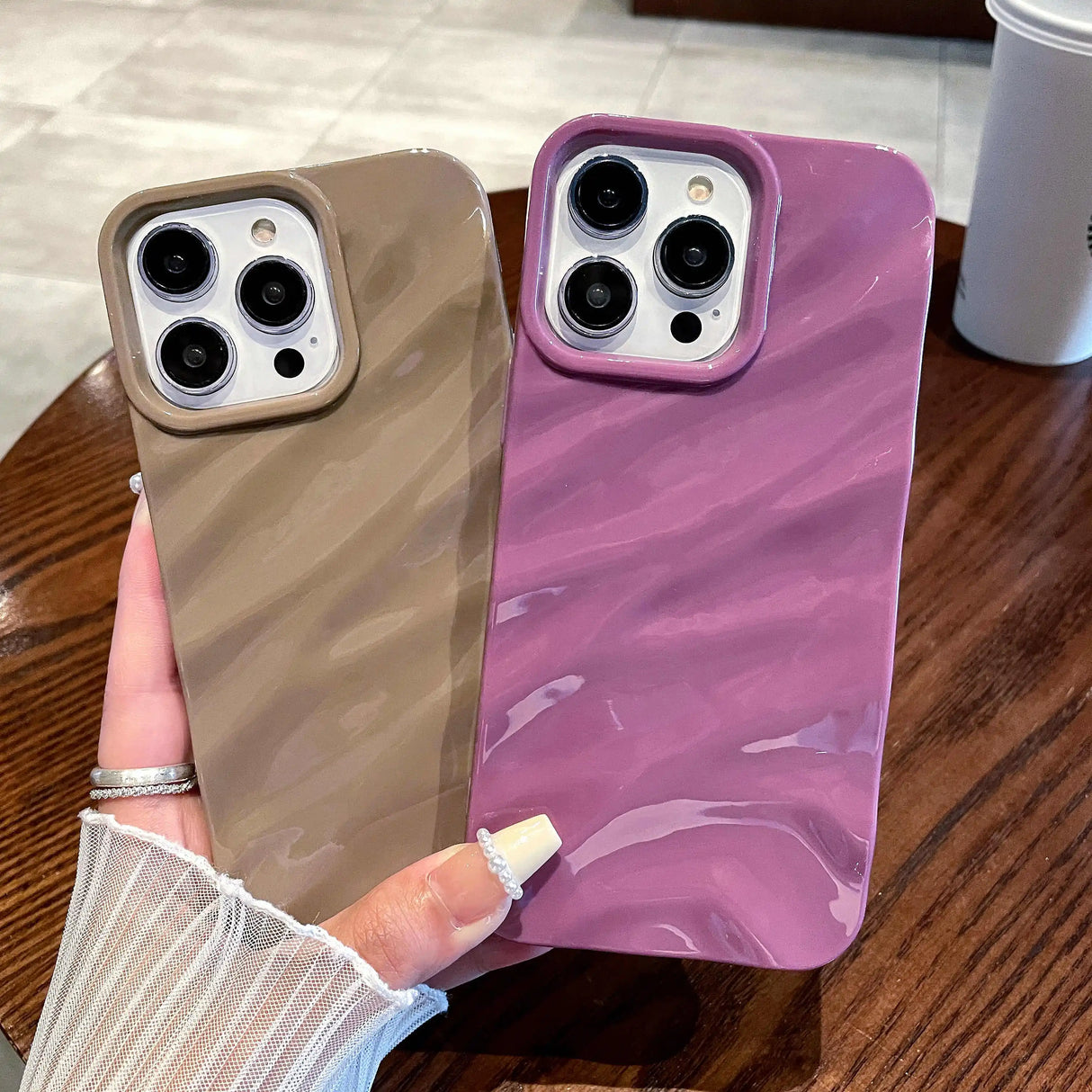 Two marble-patterned phone cases.
