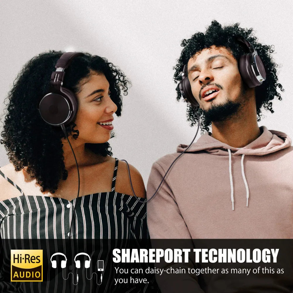 Two people wearing headphones, enjoying music together.