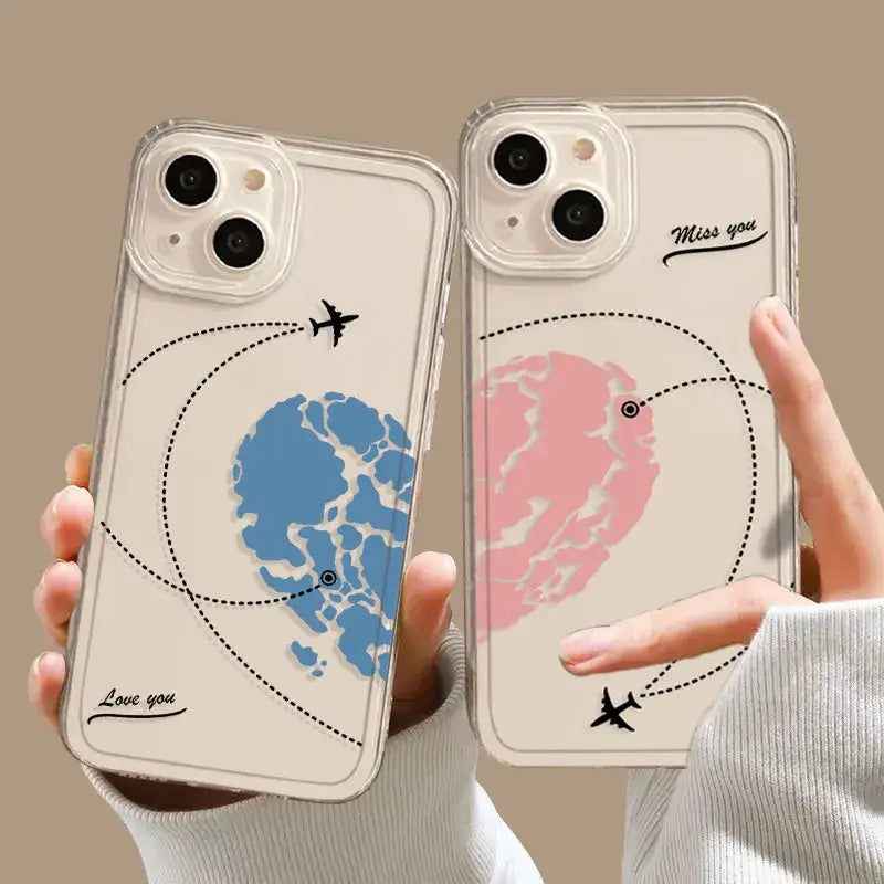 Two people holding up their iphone cases with a map of the world