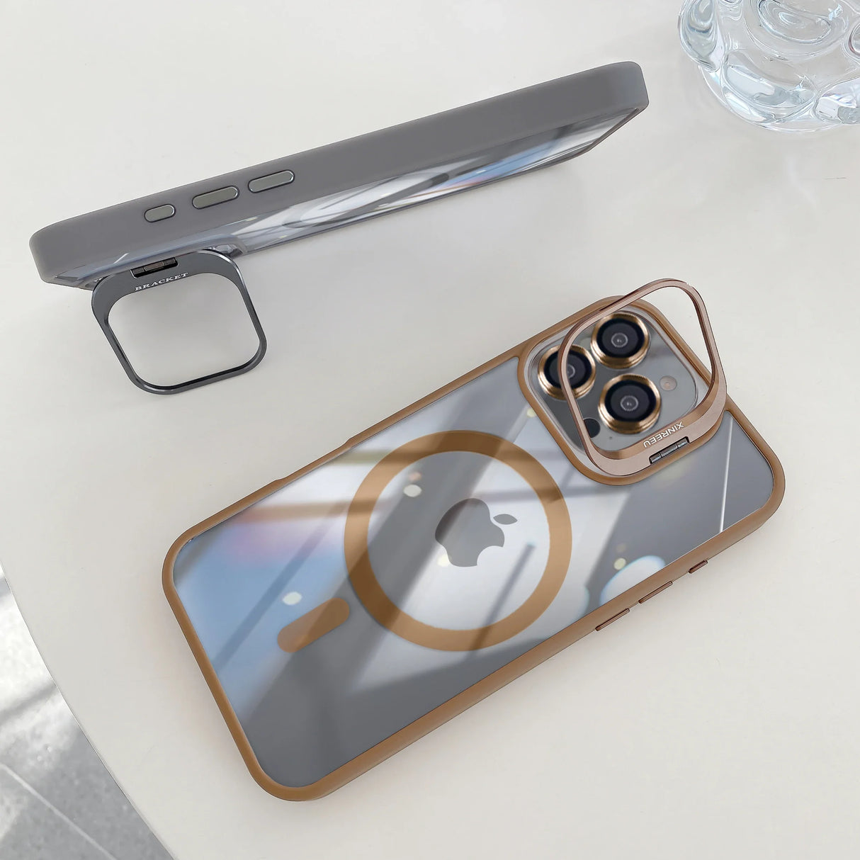 Two phone cases with camera lens protectors.