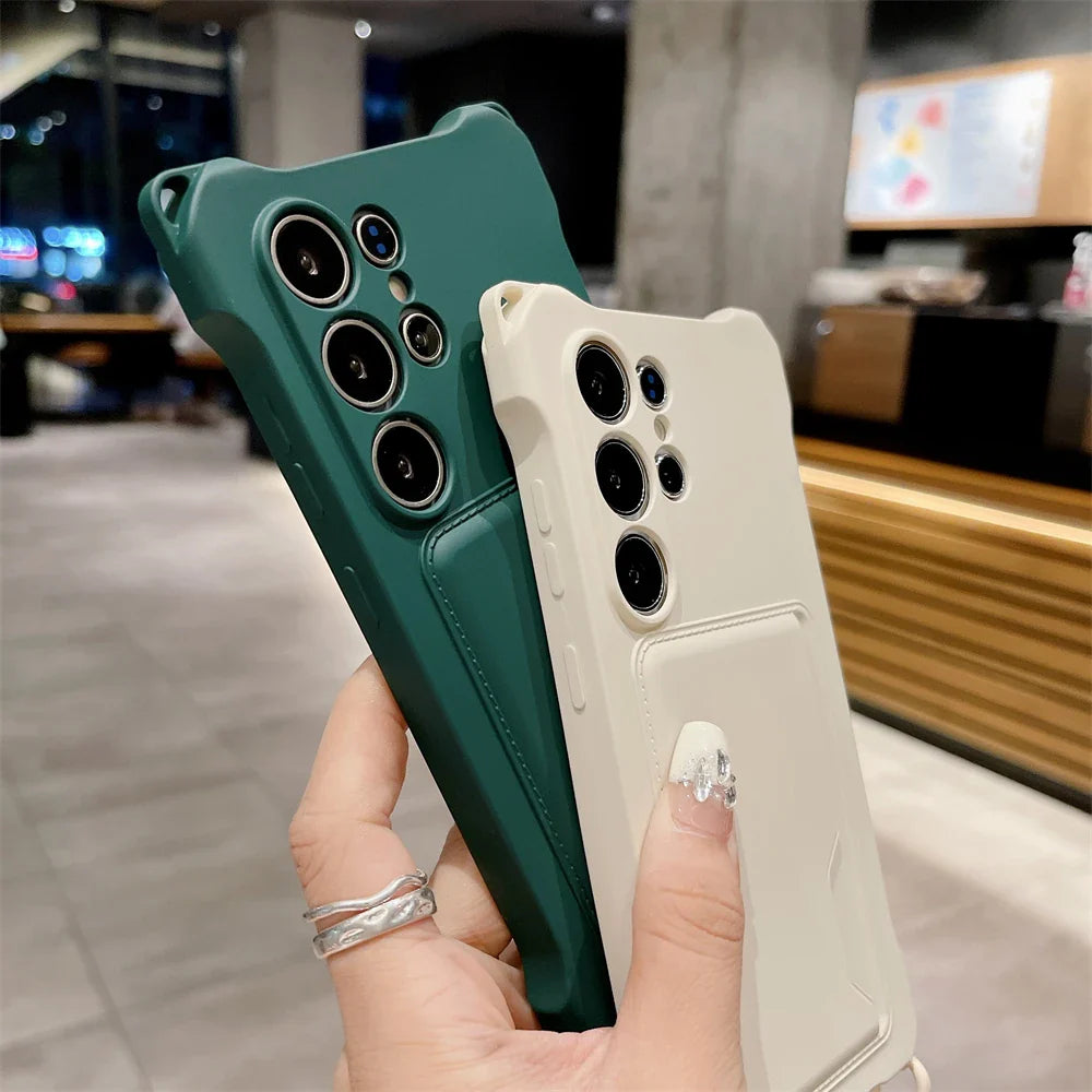 Two phone cases, one dark green and one off-white, both with a camera cutout and a card slot on the back.