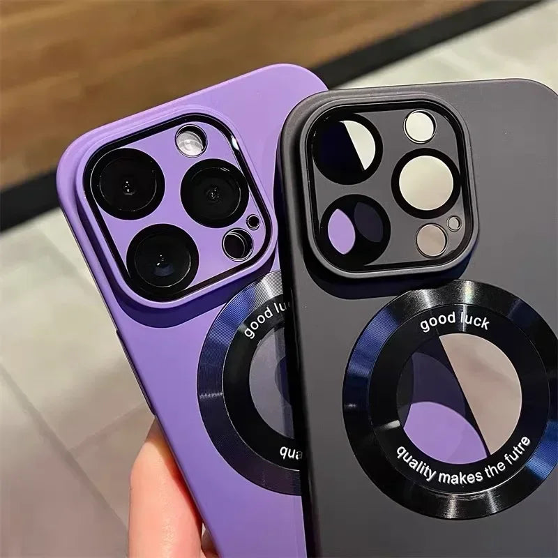 Two smartphones in protective cases, one purple and one dark gray, each with a circular magnetic accessory on the back.