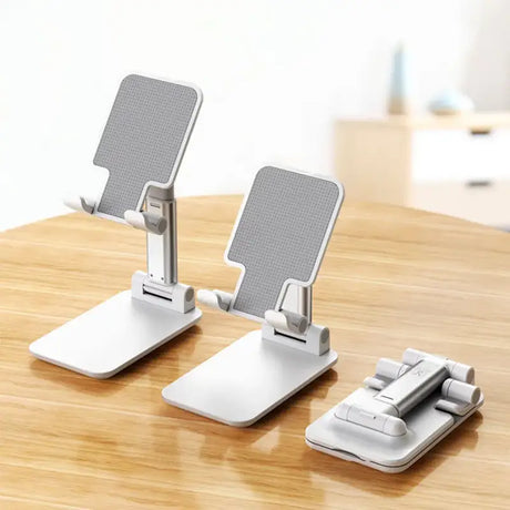 Two white desk stands on a wooden table