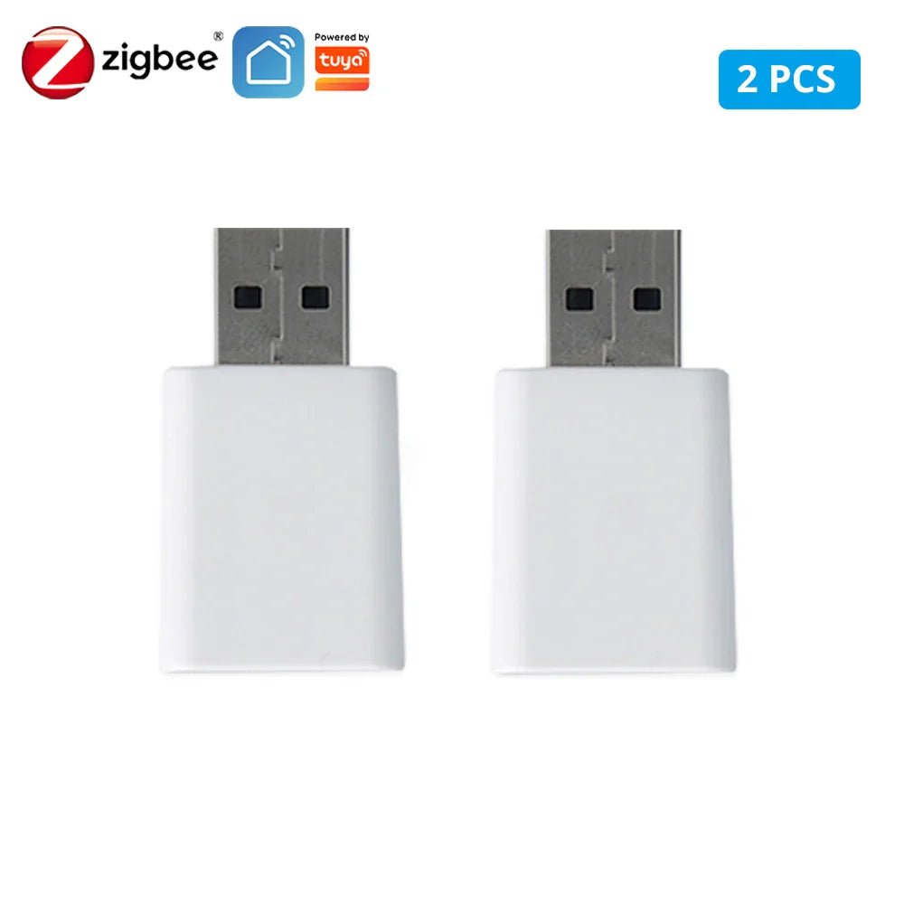 Two white USB Zigbee dongles.