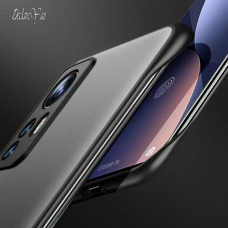 the back of a black iphone with a black background