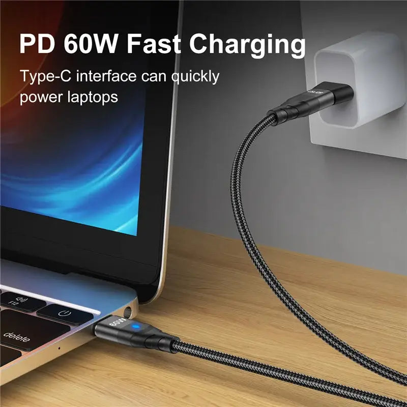 a laptop with a power cord attached to it