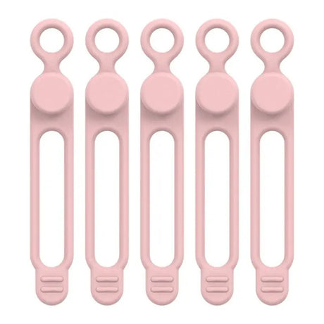 six pink plastic spoons with handles and handles on a white background